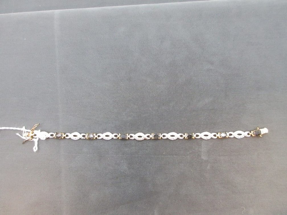 .925 Silver with gold wash and sapphire tennis bracelet