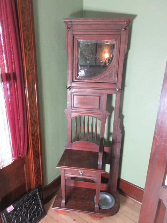 Antique hall tree stand with mirror