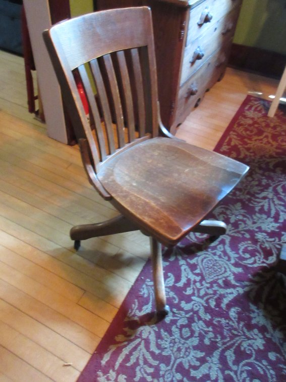 Antique oak rolling office chair