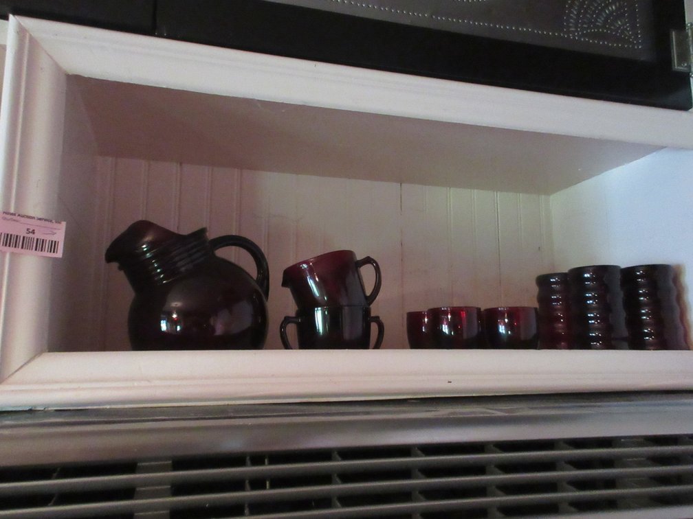 Group of ruby glasses and pitcher