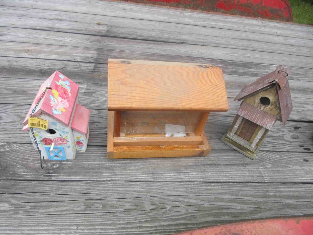 Group of bird houses and feeder