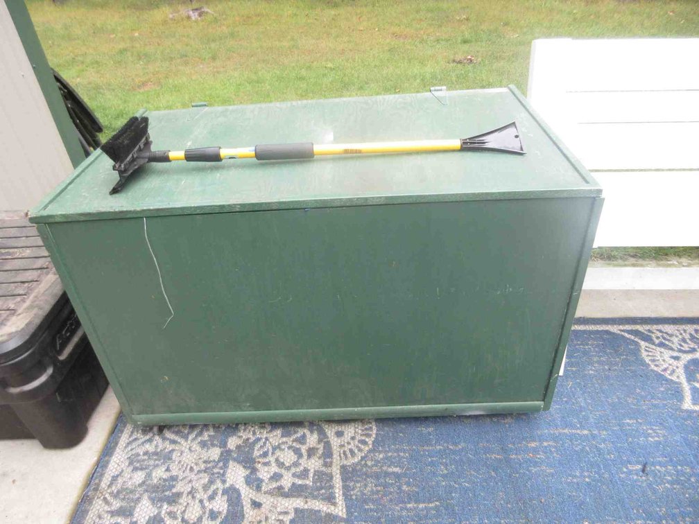 Wood rolling trunk with tarps and window scrapers