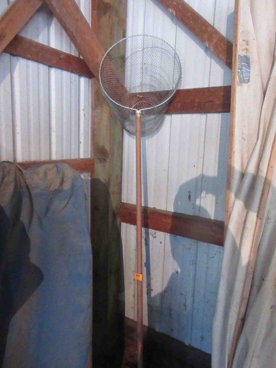 Metal fish net on pole