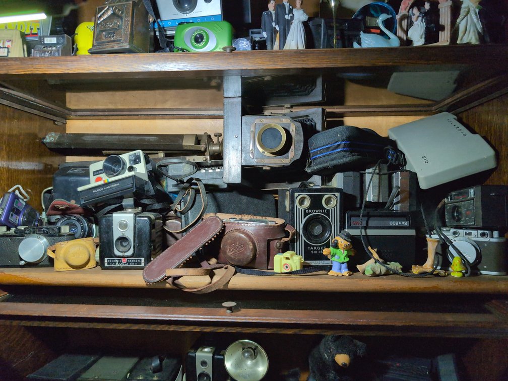 Vintage cameras and small porcelain figurines 