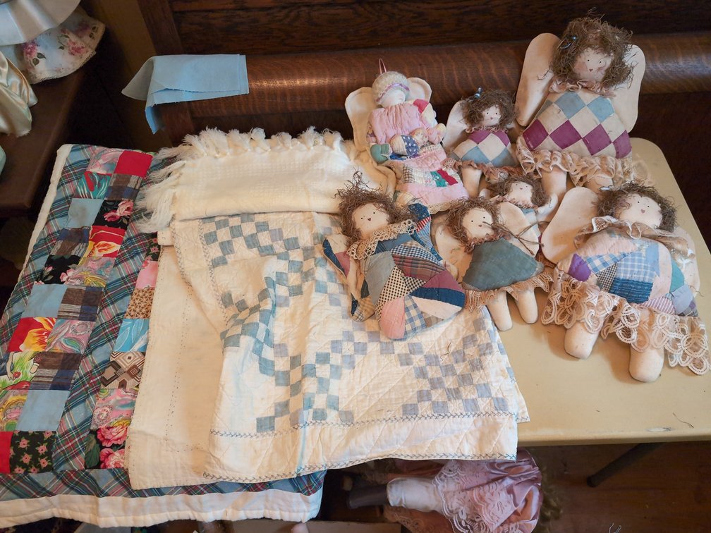 2 small quilts with quilt dolls 