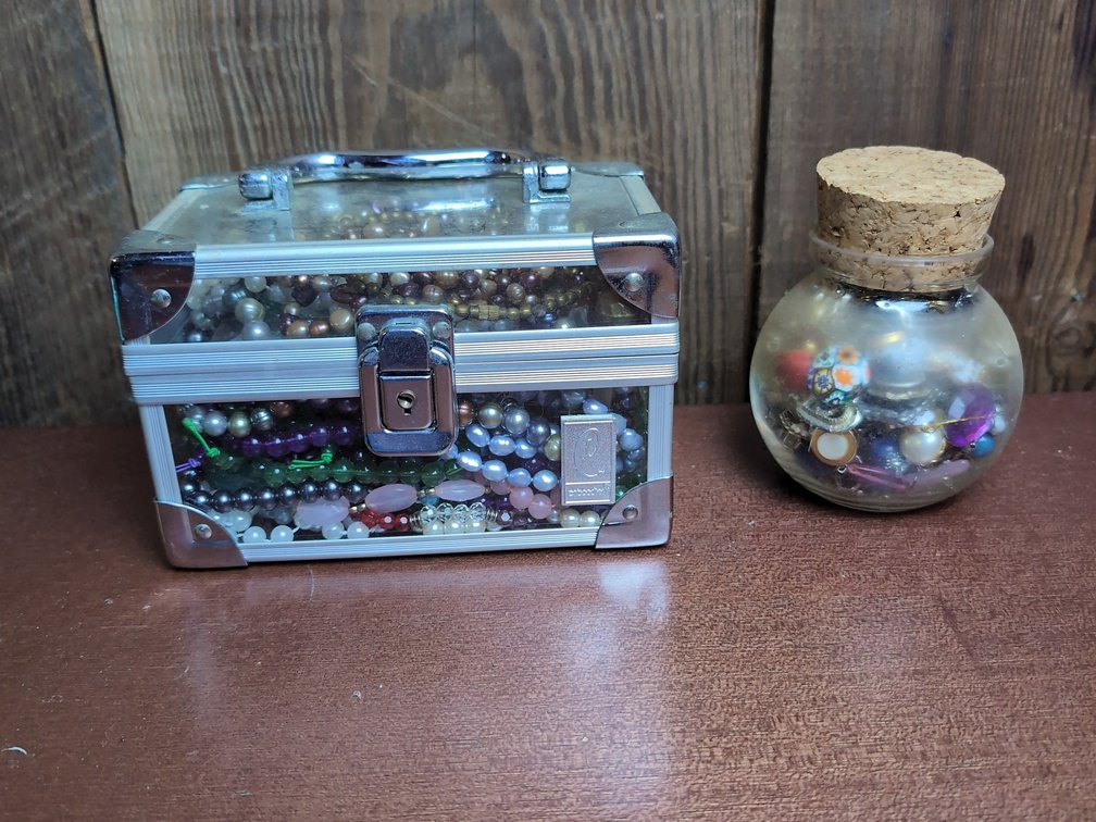 Mystery box and small jar of jewelry 