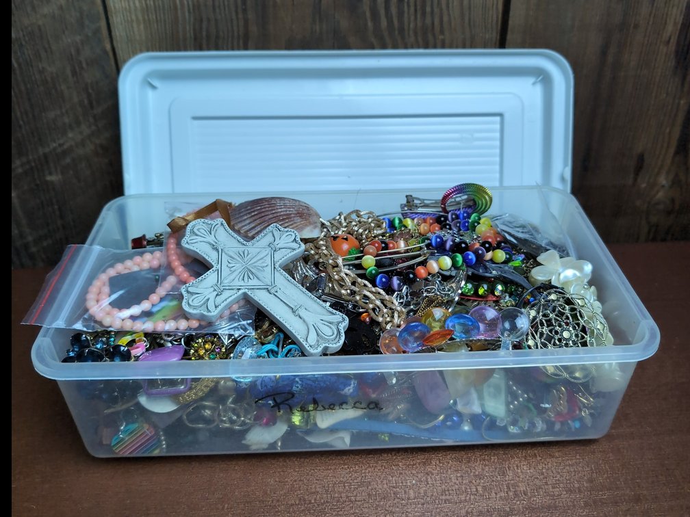 Container of mystery vintage jewelry 