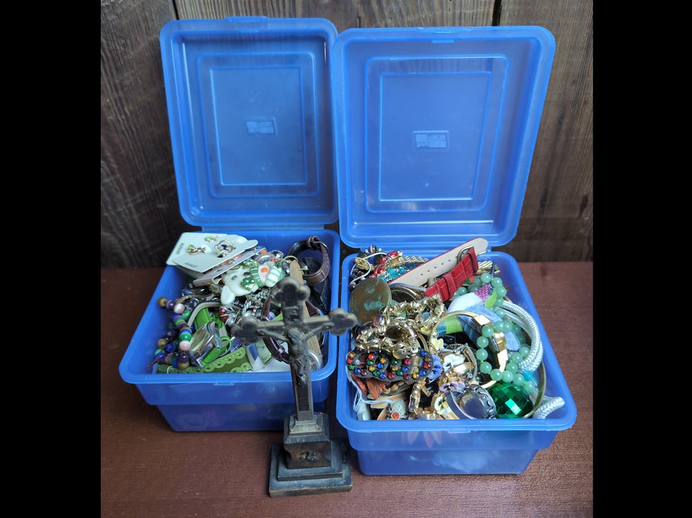 2 boxes of mystery jewelry and a cross 