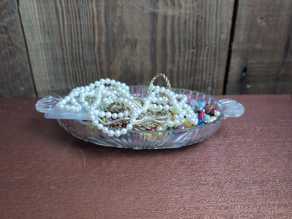 Small bowl of mystery jewelry 
