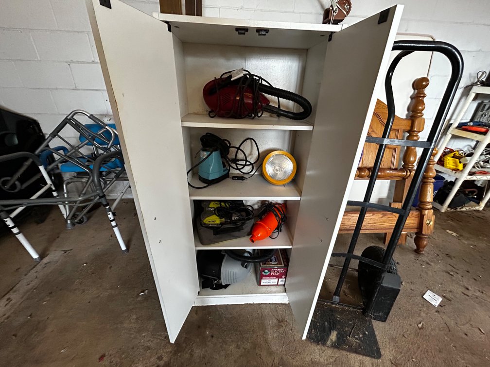 Cabinet with contents and hand truck