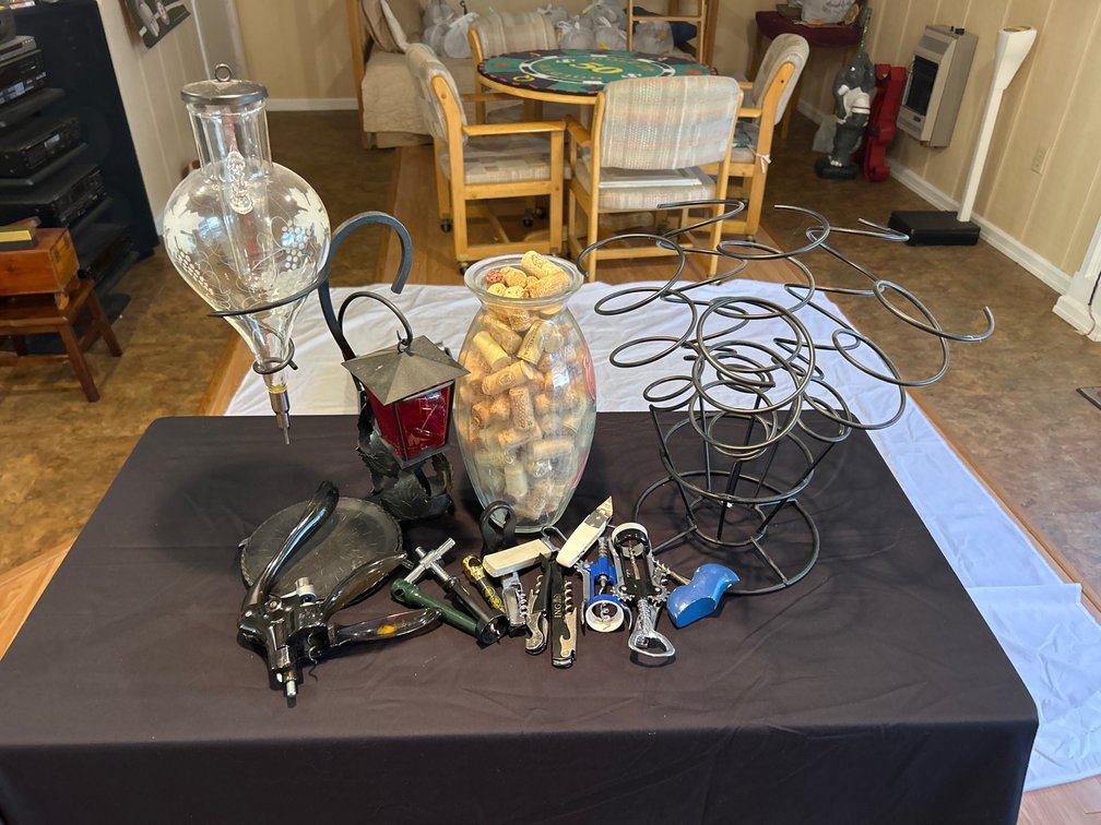 Wine-Themed Accessories and Decor - Glass Decanter on a stand, Glass Filled with Corks and Metal Wine Rack