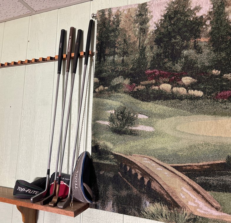 Four Golf Clubs