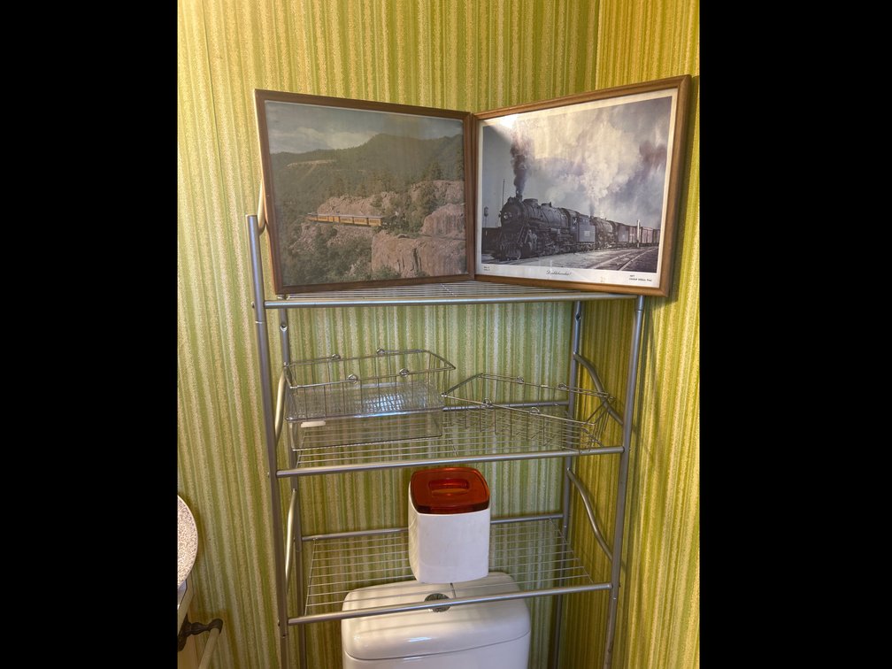 Shelf with Pictures, Metal Baskets, Kleenex Holder