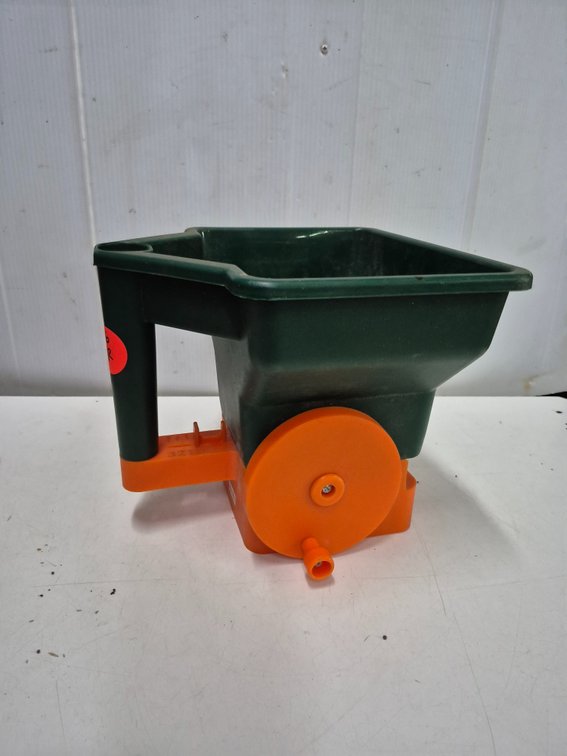 Plastic handheld broadcast seed spreader