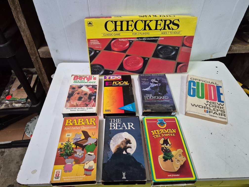 Checkers game, VHS movies, 1964 world's fair guide