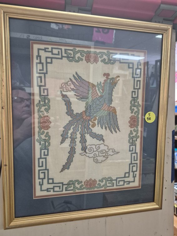 Framed, matted cross stitch work