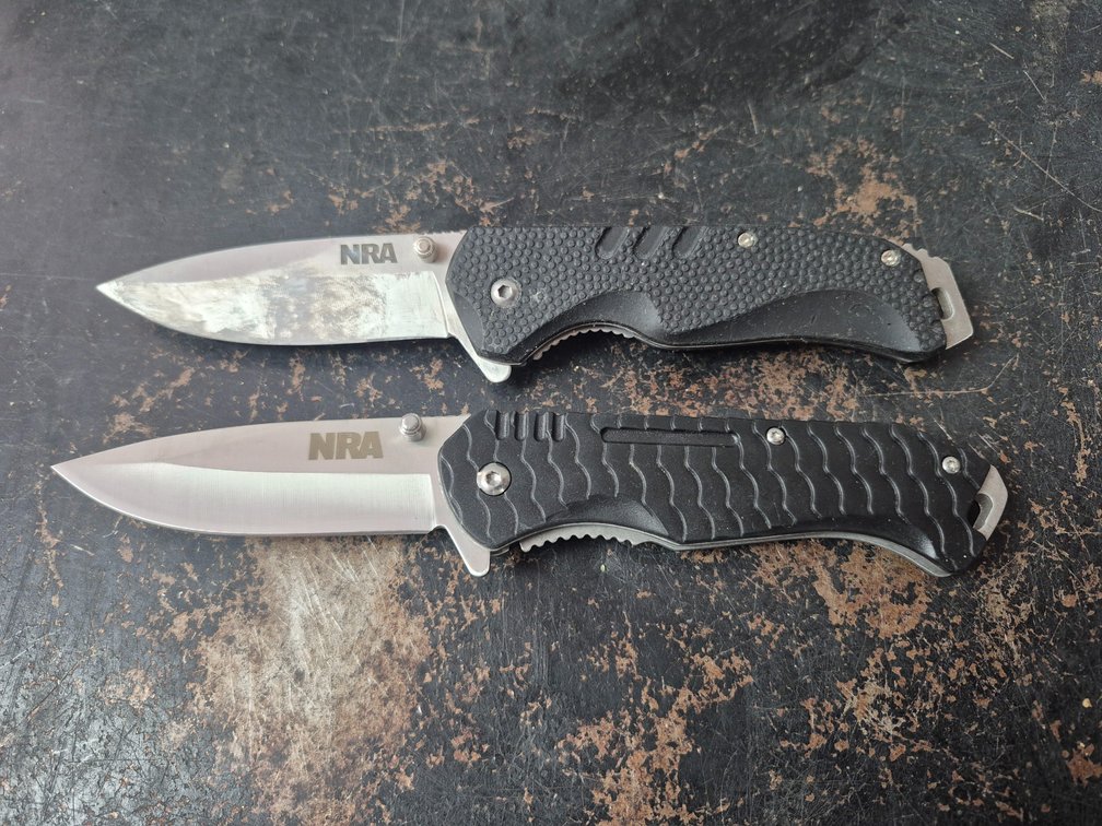 (2) NRA folding lockblade knives