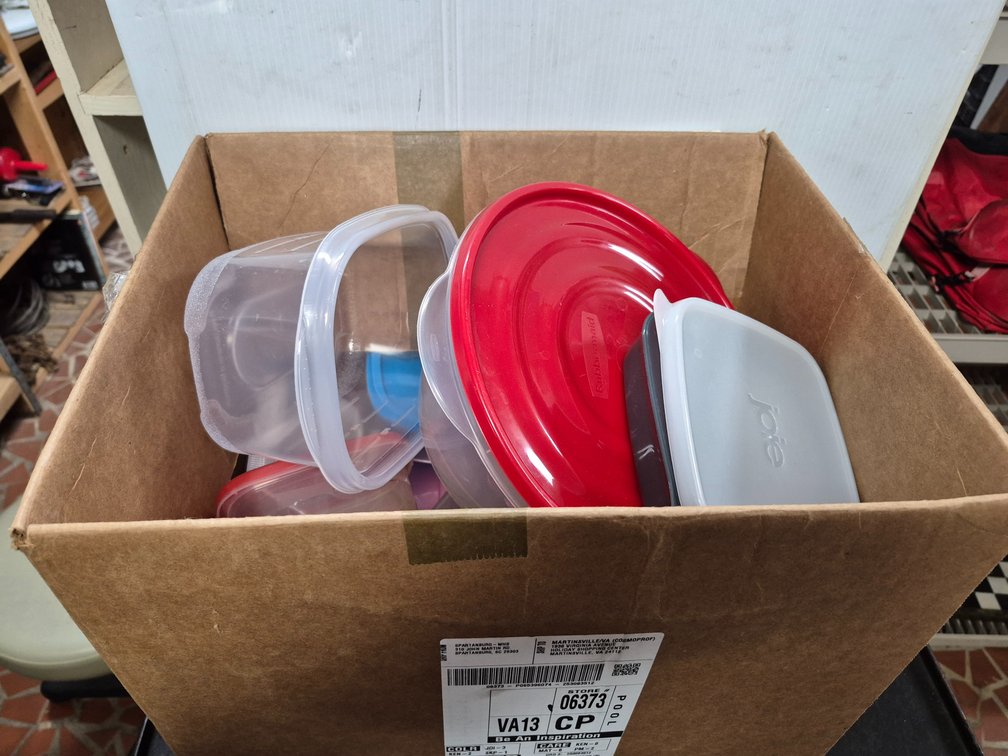 Box full of plastic bowls+