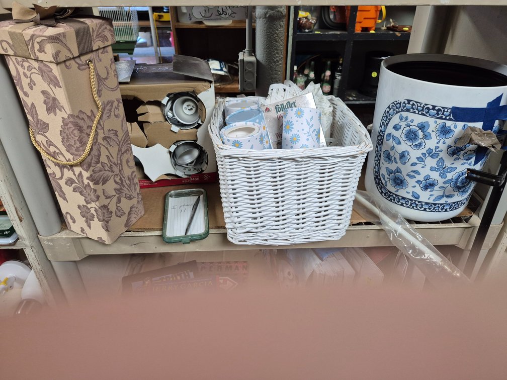 Shelf of recessed lights, wicker basket of tissues, planters++