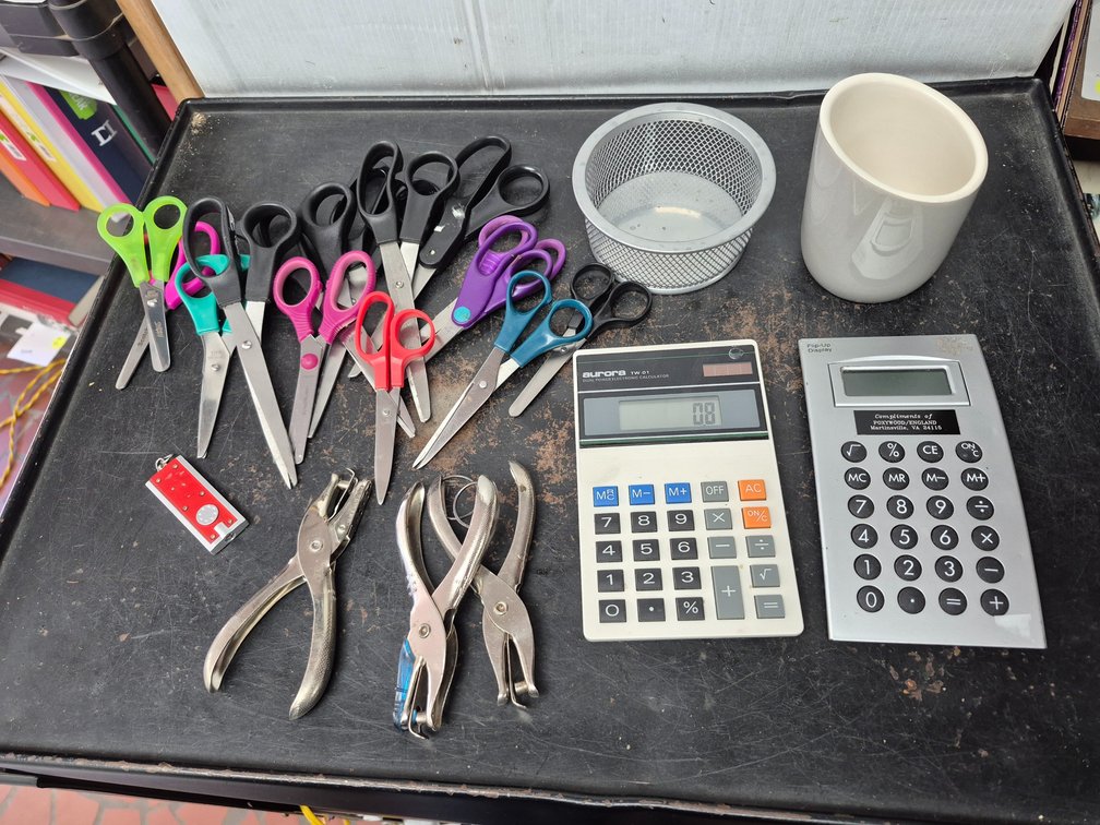 Assorted office supplies, scissors +