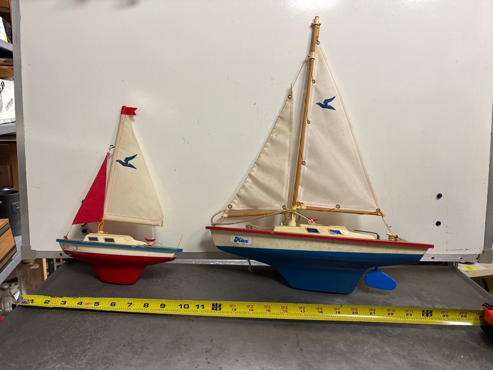 Two toy sailboats