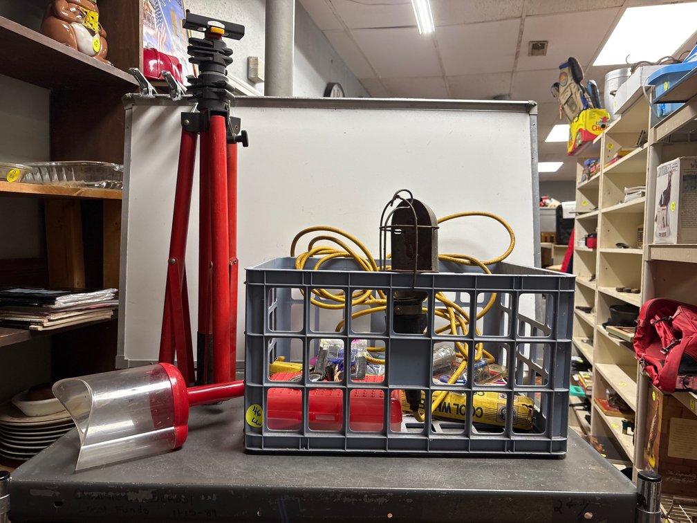 Crate with tripod, drop light, and more