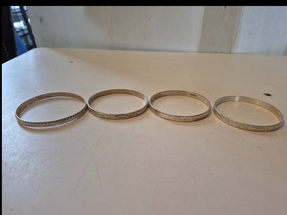 (4) silver toned bracelets marked Mexico