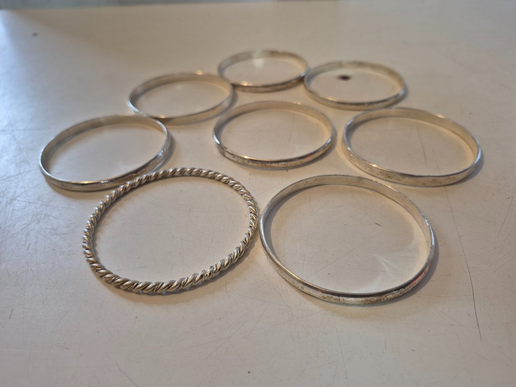 (8) silver toned bangles