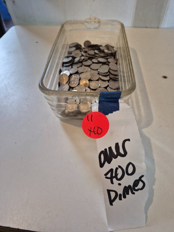 Glass dish with over 700 unsorted dimes
