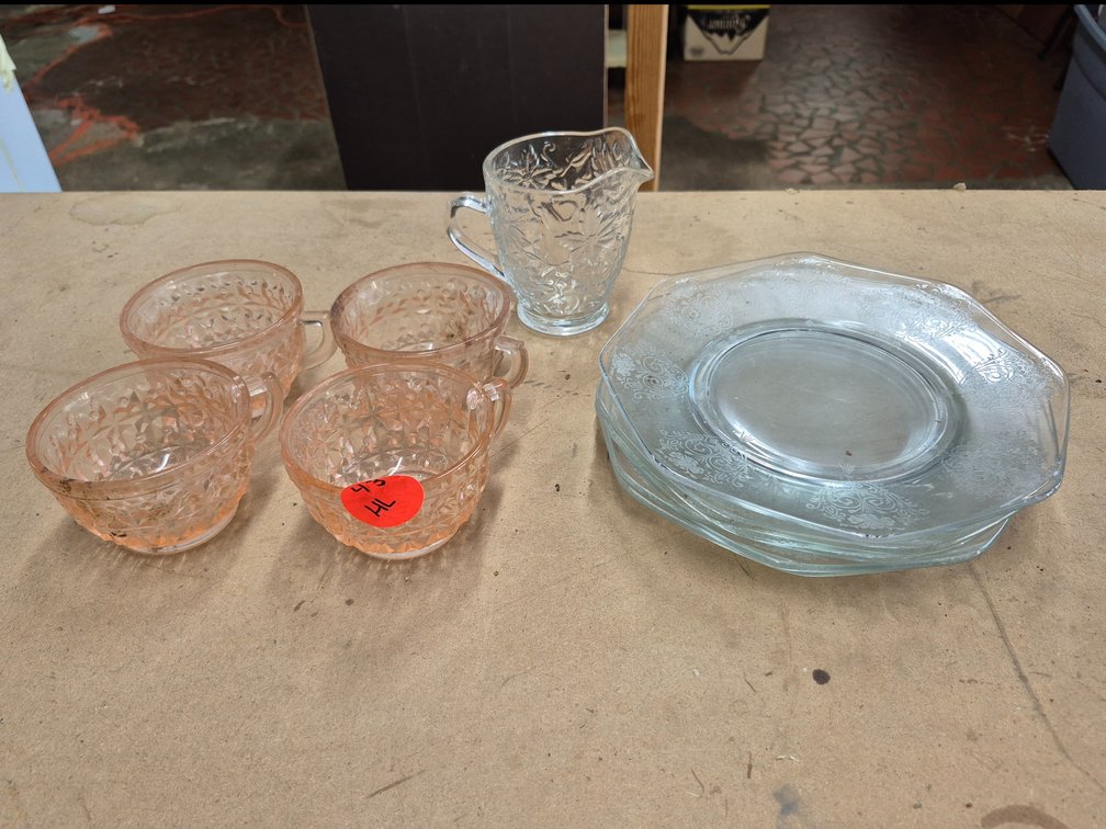 Pink and clear depression glass dishes and a creamer