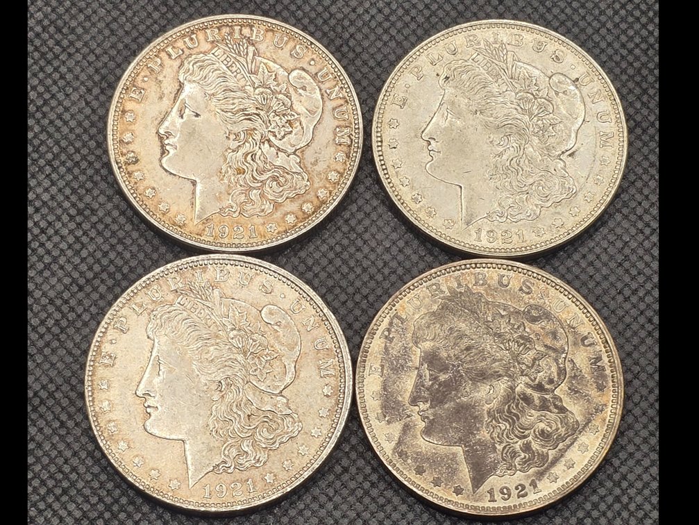 Four Morgan Silver Dollars