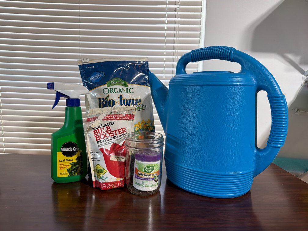Gardening Supplies With Blue Watering Can