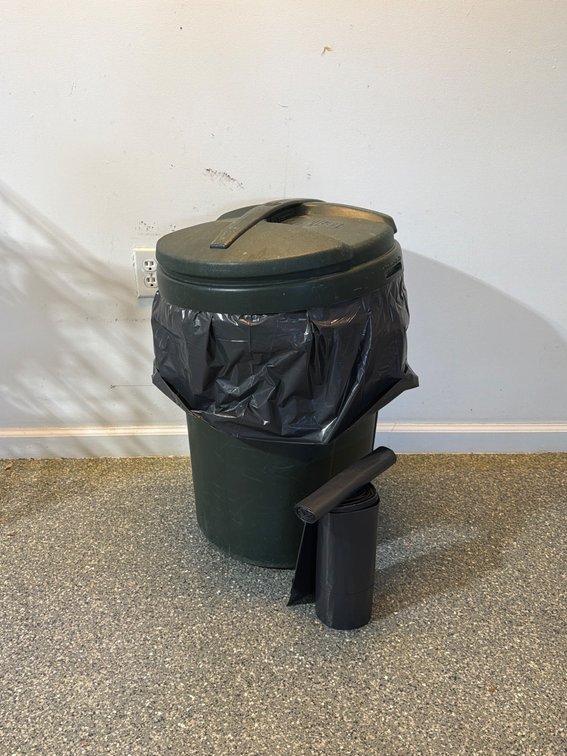 Green Plastic Trash Can with Lid