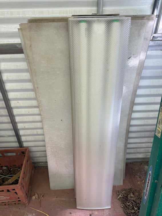 Two 4’ Fluorescent Light Fixtures and several troffer light covers
