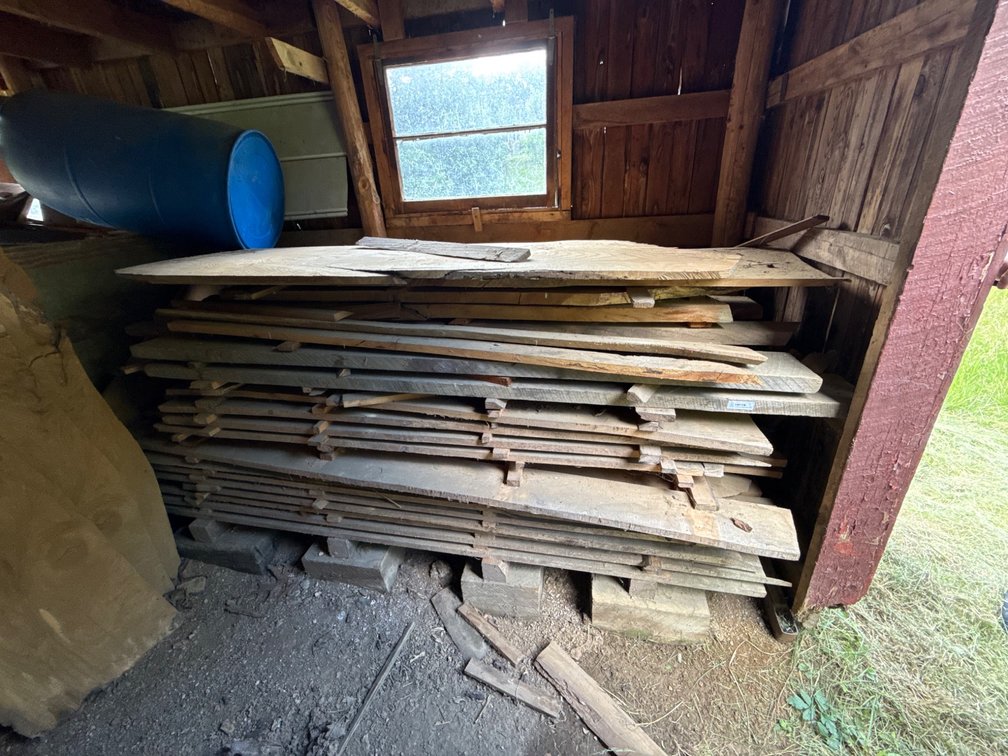 Stack of Rough-Cut Wood Planks and Slabs