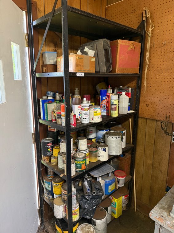 Metal Shelving Unit with Assorted Paints and Supplies