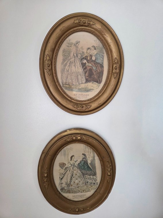 Pair of Framed Le Follet Oval Fashion Prints