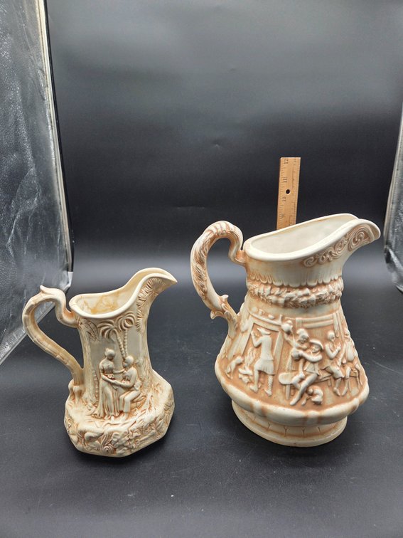 Relief-Molded Glazed Ceramic Pitchers