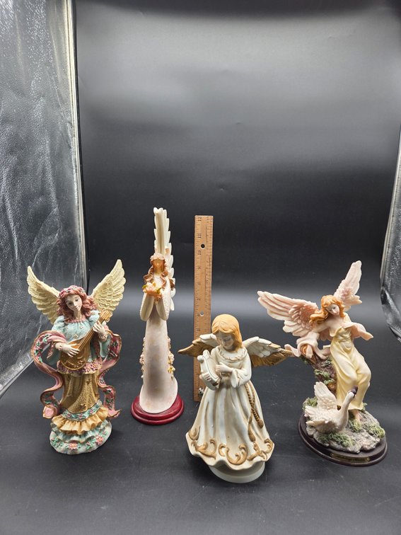 Four Cast Resin and Ceramic Angel Figurines