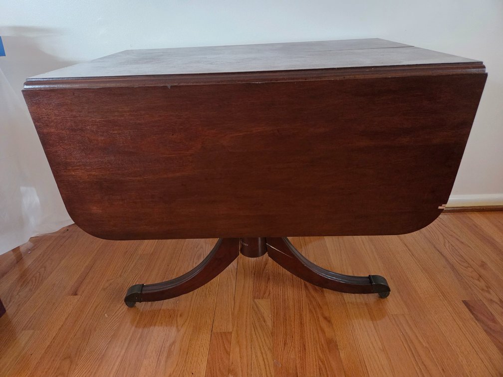 Dark Stained Wood Drop-Leaf Pedestal Dining Table