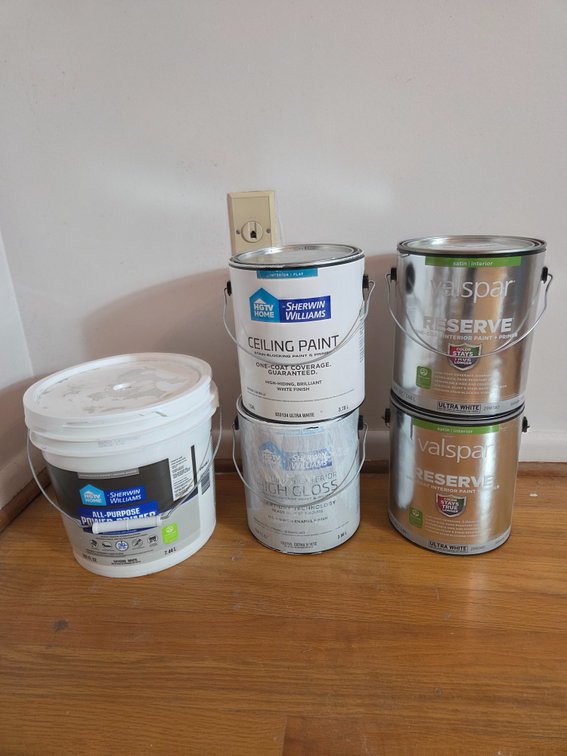 Interior and Exterior Paint and Primer Cans
