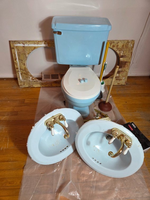 Light Blue Porcelain Toilet and Two Oval Sinks