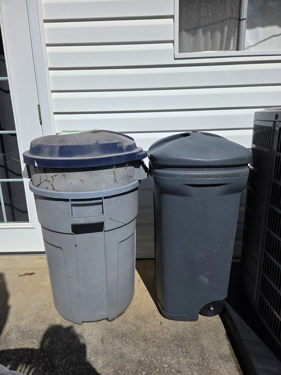 Three Plastic Outdoor Trash Cans with Lids