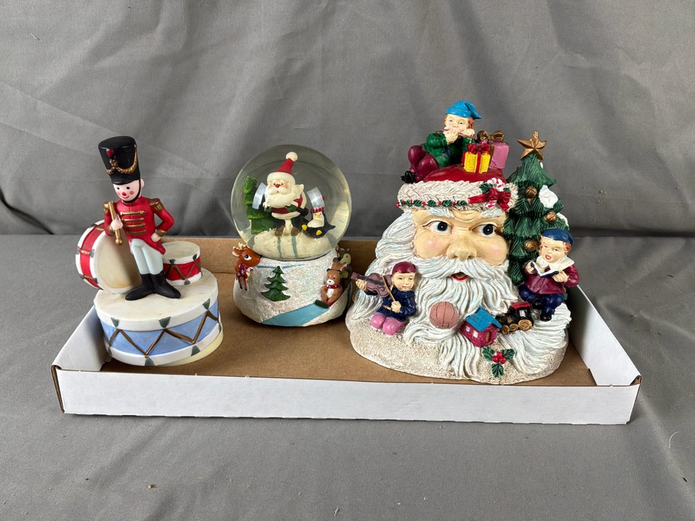 Santa Claus Bust, Toy Soldier Figurine, and Snow Globe
