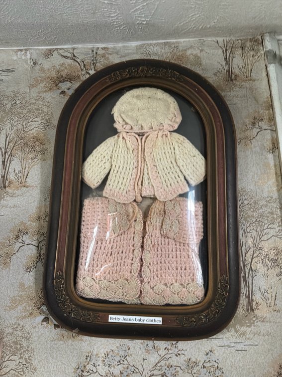 Framed Crocheted Baby Clothes in Shadowbox