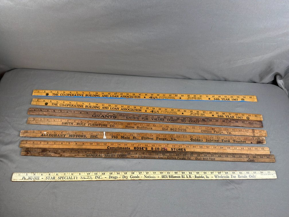 Eight Wooden Advertising Yardsticks
