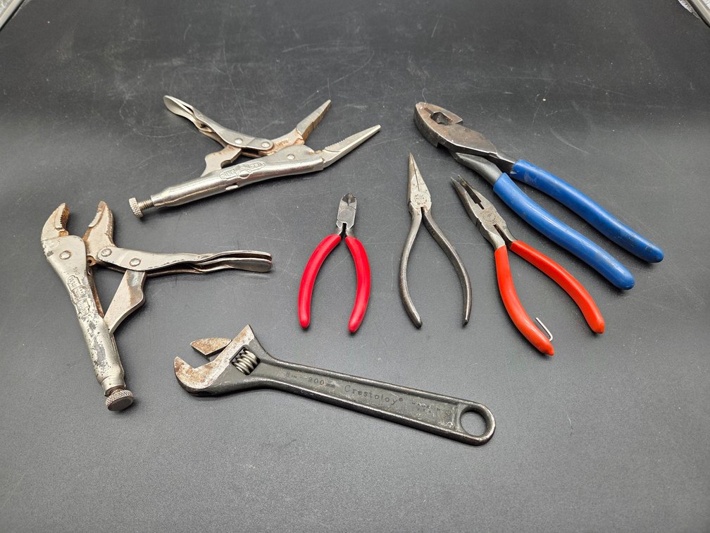 Locking Pliers, Adjustable Wrench, and Pliers