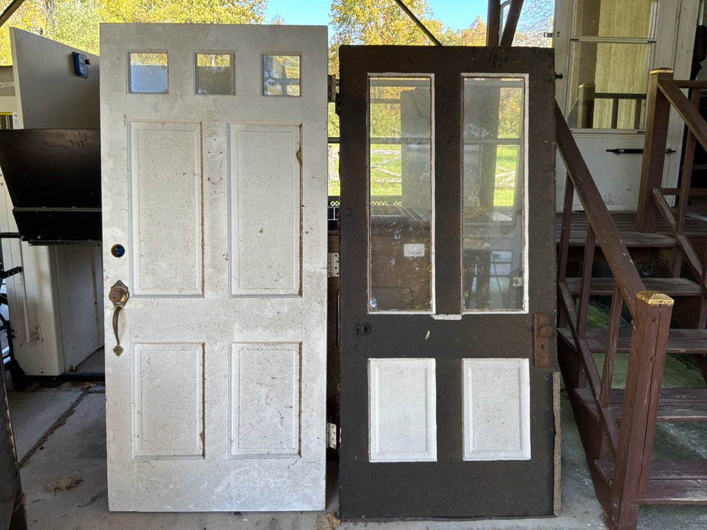 Two Paneled Wood Doors with Glass Panes