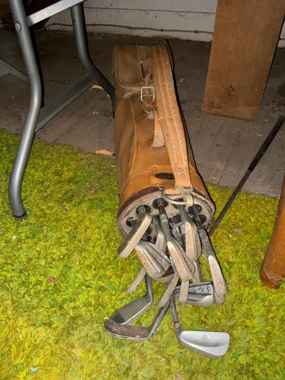 Brown Golf Bag with Carry Strap and Golf Clubs