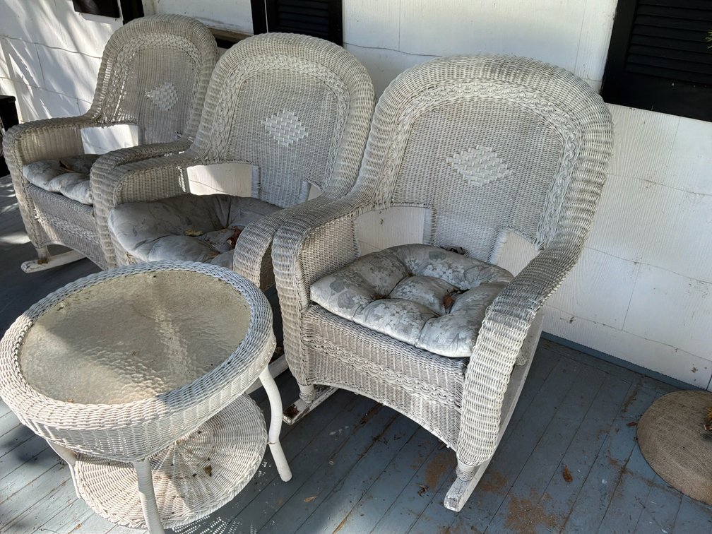 White Wicker Rocking Chairs and Round Side Table
